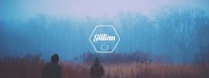 gillian photography logo on image of two men walking through a misty field